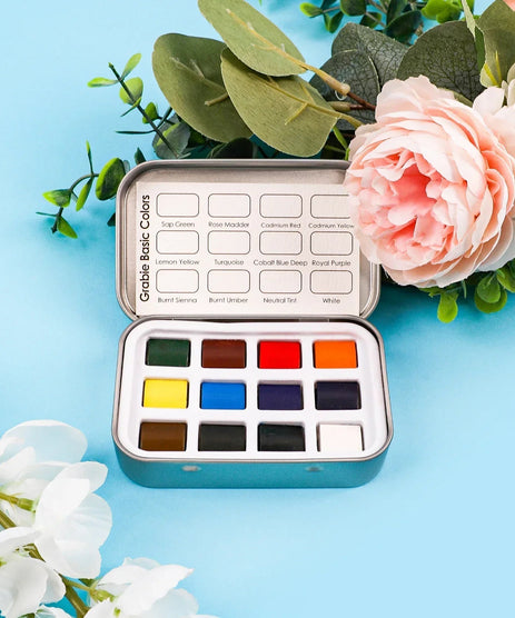 https://cdn.shopify.com/s/files/1/0729/6961/7689/files/Grabie_Watercolor_Pocket_Set_of_12_-_Essential_Colors_Grabie_Art_Supplies_Best_Watercolor_Artist_Watercolor_Best_Beginner_Watercolor_Set.jpg?v=1772696348