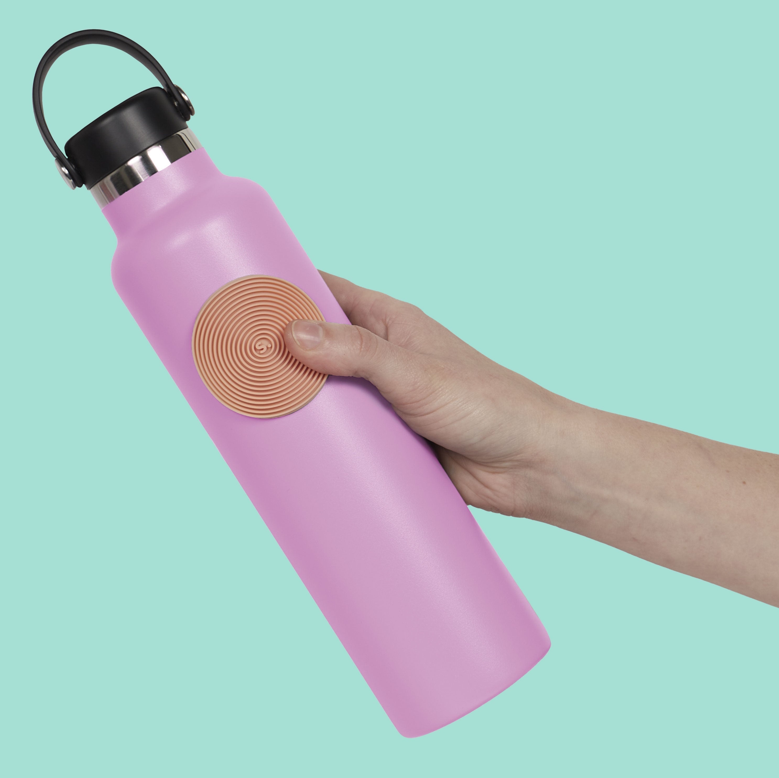 https://cdn.shopify.com/s/files/1/0756/6183/6582/files/SlabsCircleGrooveOrange_Bottle1.jpg?v=1767716609