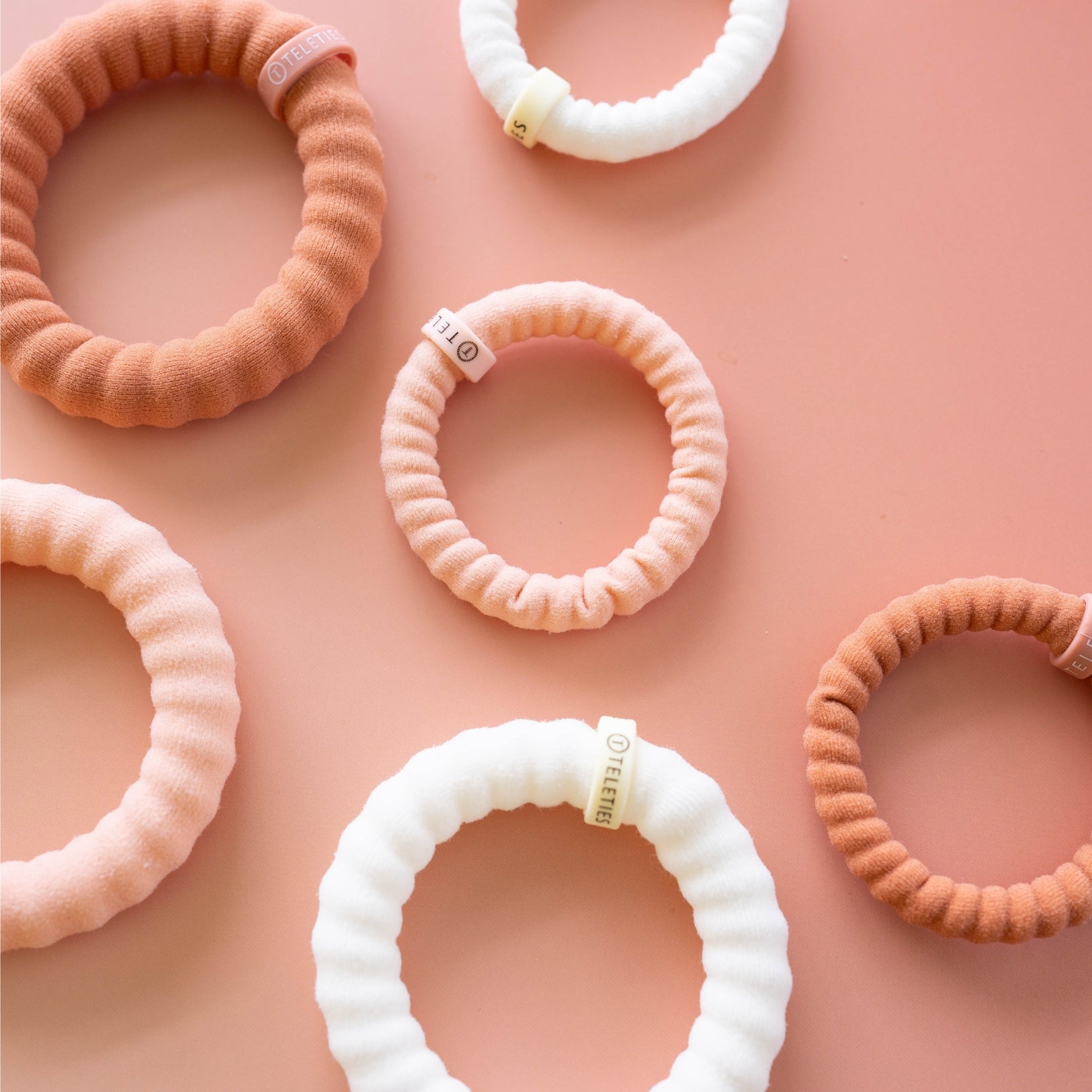 https://cdn.shopify.com/s/files/1/0065/8459/8593/files/for-the-love-of-nudes-small-nylon-hair-ties-hair-ties-3050636.jpg?v=1758096626