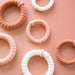 https://cdn.shopify.com/s/files/1/0065/8459/8593/files/for-the-love-of-nudes-small-nylon-hair-ties-hair-ties-3050636.jpg?v=1758096626