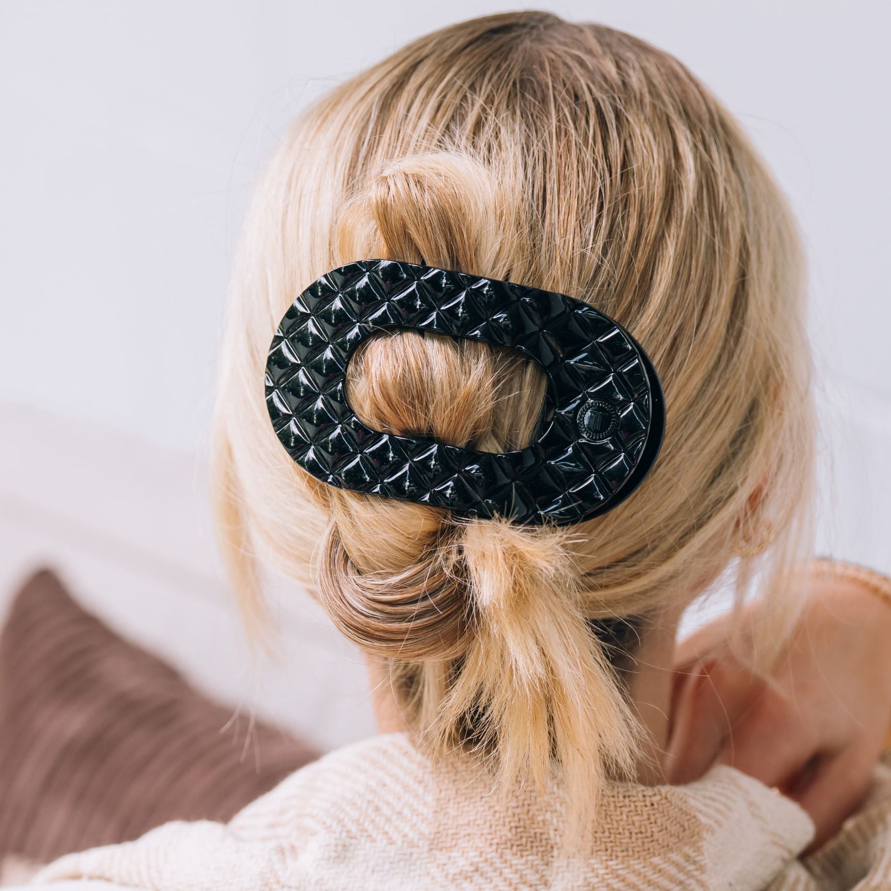https://cdn.shopify.com/s/files/1/0065/8459/8593/files/jet-black-quilted-large-flat-round-hair-clip-hair-clips-4498395.jpg?v=1752708702