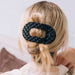 https://cdn.shopify.com/s/files/1/0065/8459/8593/files/jet-black-quilted-large-flat-round-hair-clip-hair-clips-4498395.jpg?v=1752708702