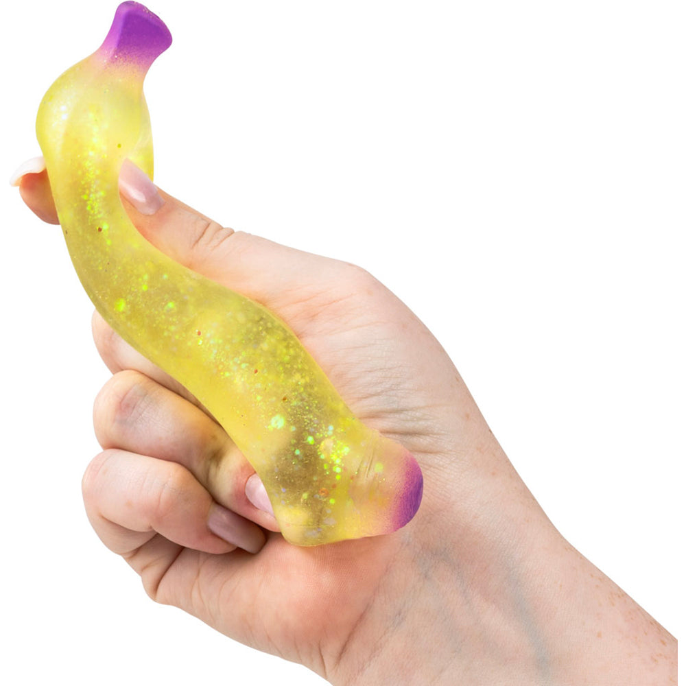 https://dc2zcmcikfrna.cloudfront.net/images/nv2496_aa-global-squish-glitter-sugar-banana-asst-squeezed-in-hand-large-pic.jpg?v=3983437828