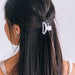 https://cdn.shopify.com/s/files/1/0065/8459/8593/products/open-coconut-white-tiny-hair-clip-tiny-hair-clip-691806.jpg?v=1686691303