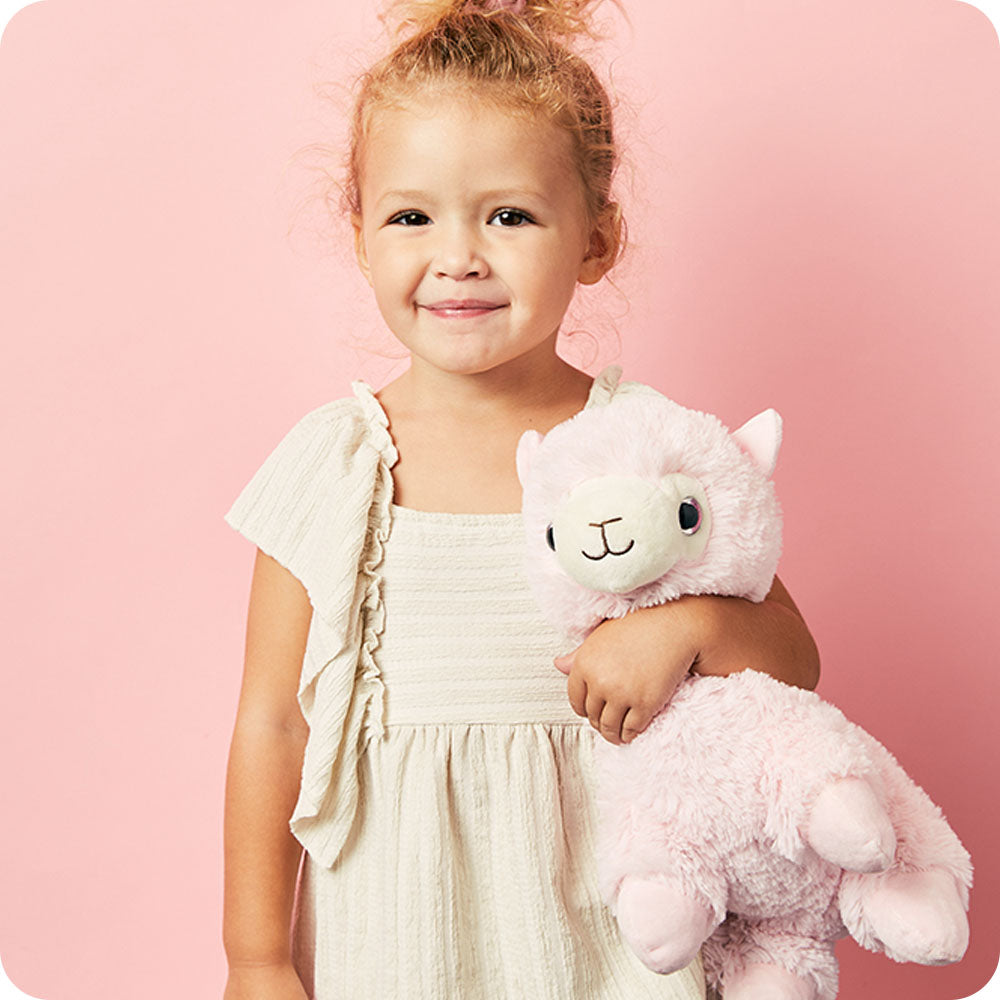 https://cdn.shopify.com/s/files/1/0284/0680/8664/files/pink_llama_warmies_lifestyle.jpg?v=1759189447