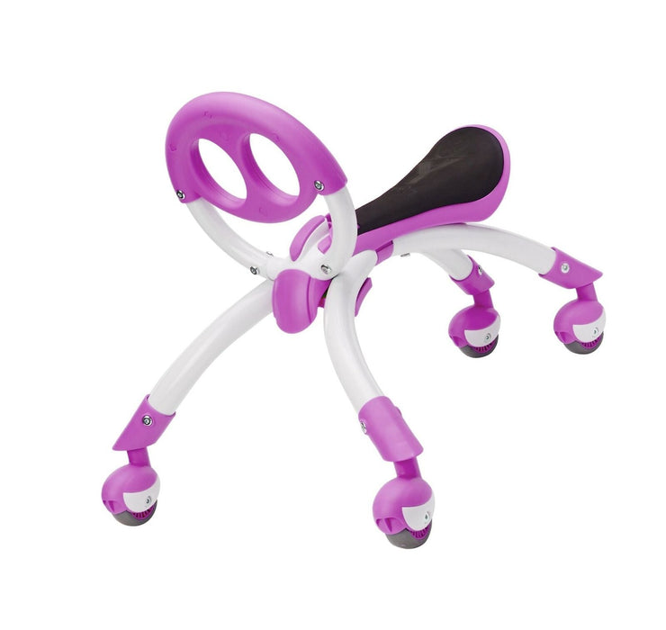 A purple and white YBike Pewi Elite push toy for toddlers, featuring a molded plastic seat with a soft foam pad, easy grip handle, and multi-directional caster wheels.