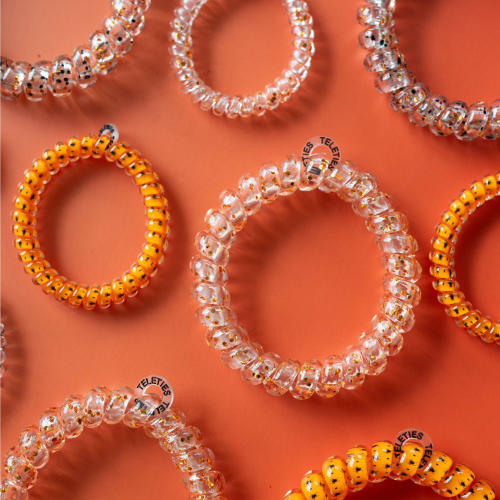 https://cdn.shopify.com/s/files/1/0065/8459/8593/files/spooky-sparkles-small-hair-ties-hair-ties-7657978.jpg?v=1757471643