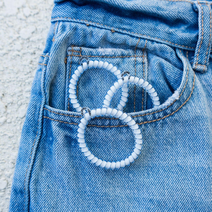 https://cdn.shopify.com/s/files/1/0065/8459/8593/files/washed-denim-small-hair-ties-hair-ties-986498.jpg?v=1747771547